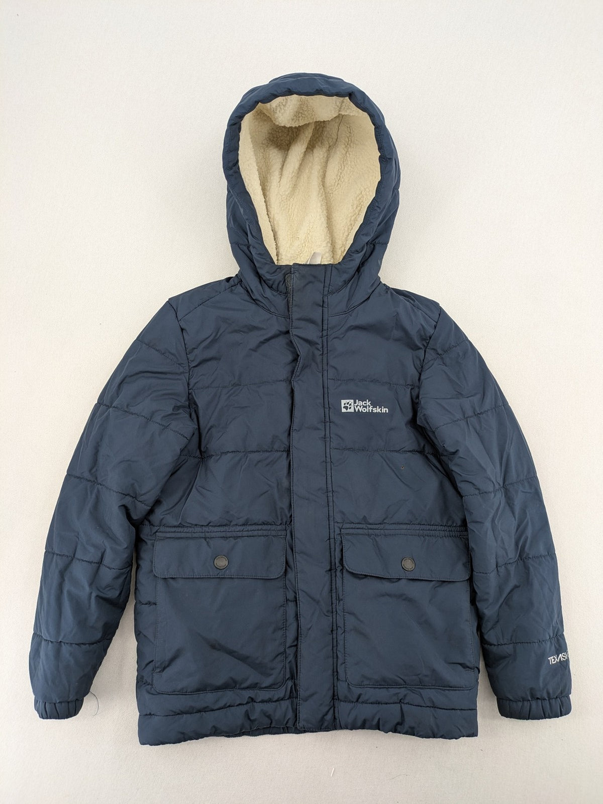 Jack Wolfskin cream and navy puffer coat with quilted design and Sherpa fleece lining.