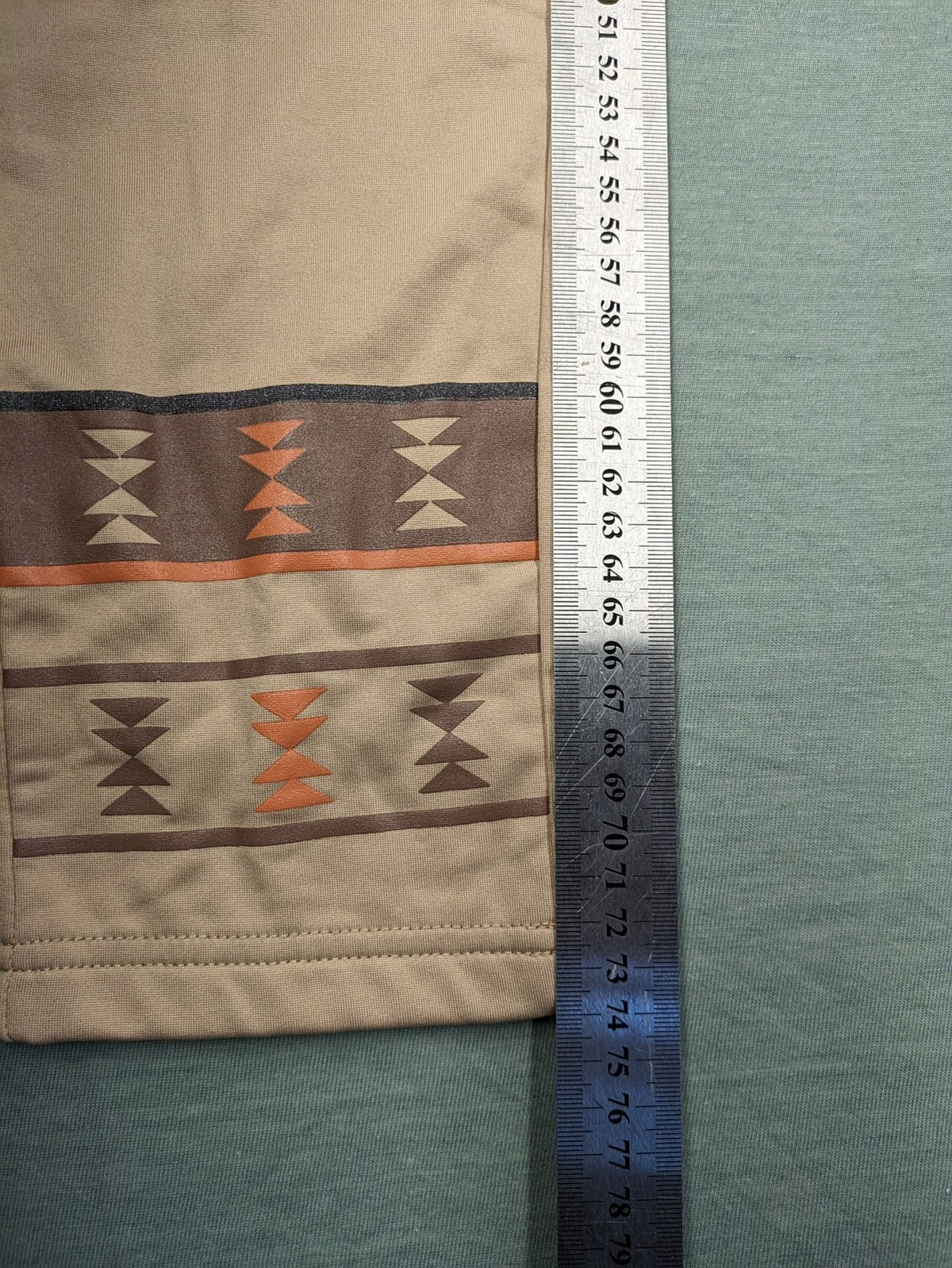 bpc bonprix collection beige leggings with colorful Aztec pattern at knees and hem