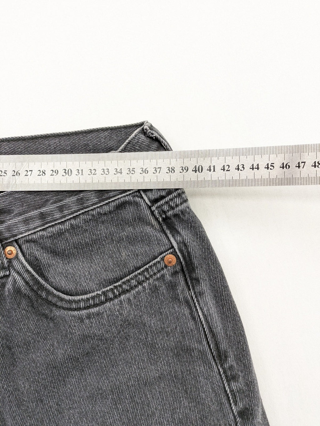 Weekday grey straight jeans with button fly and classic denim design.