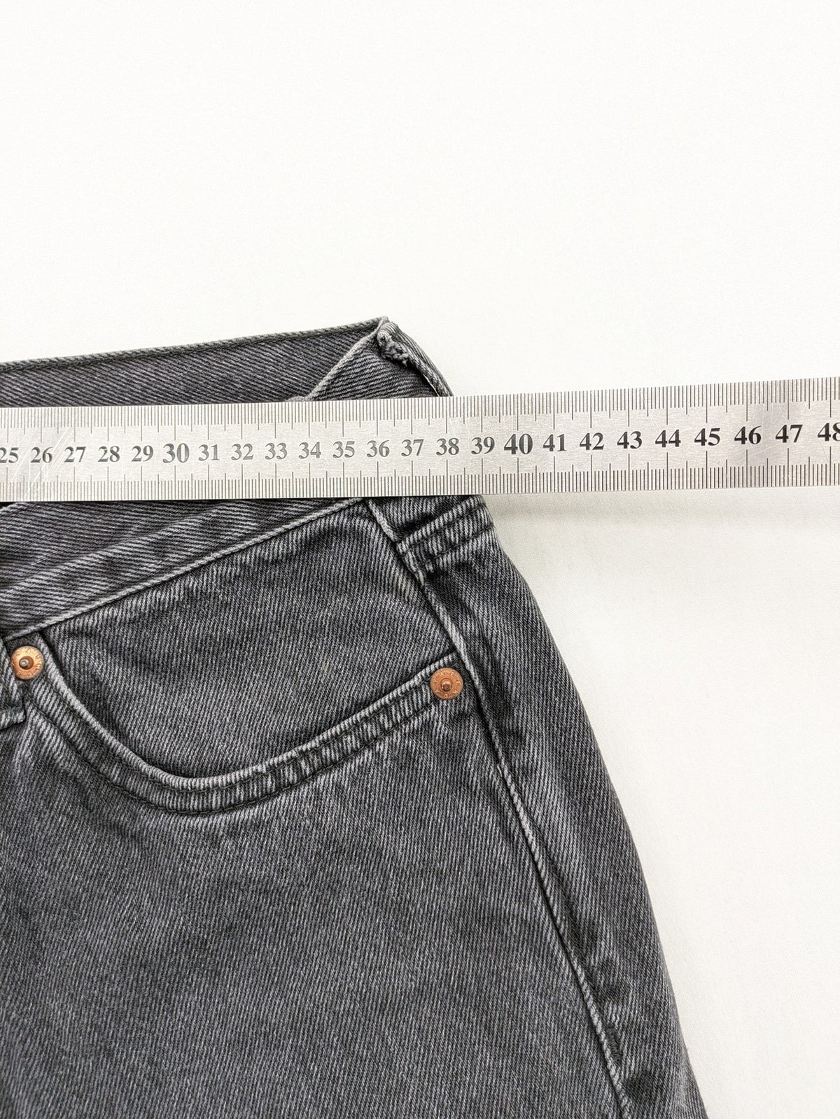 Weekday grey straight jeans with button fly and classic denim design.