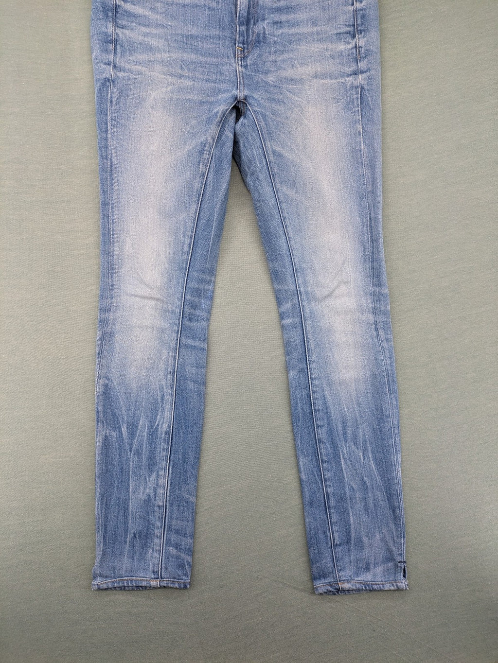 G-Star Raw blue slim skinny jeans with light wash and signature back zip pocket.