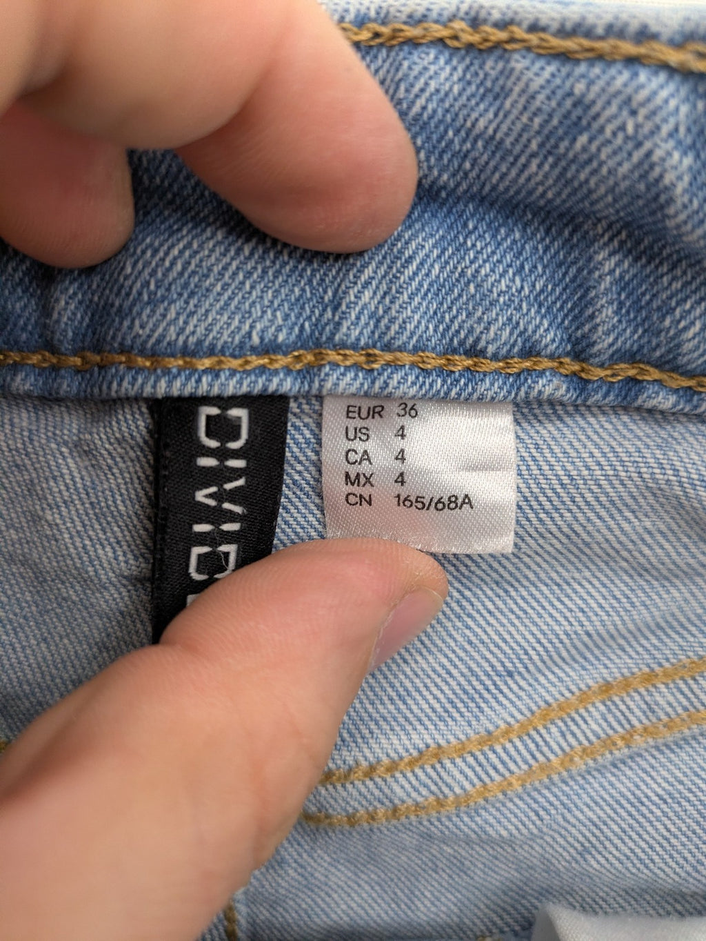 H&M Divided blue mom jeans high waist tapered fit with classic wash and durable cotton blend.