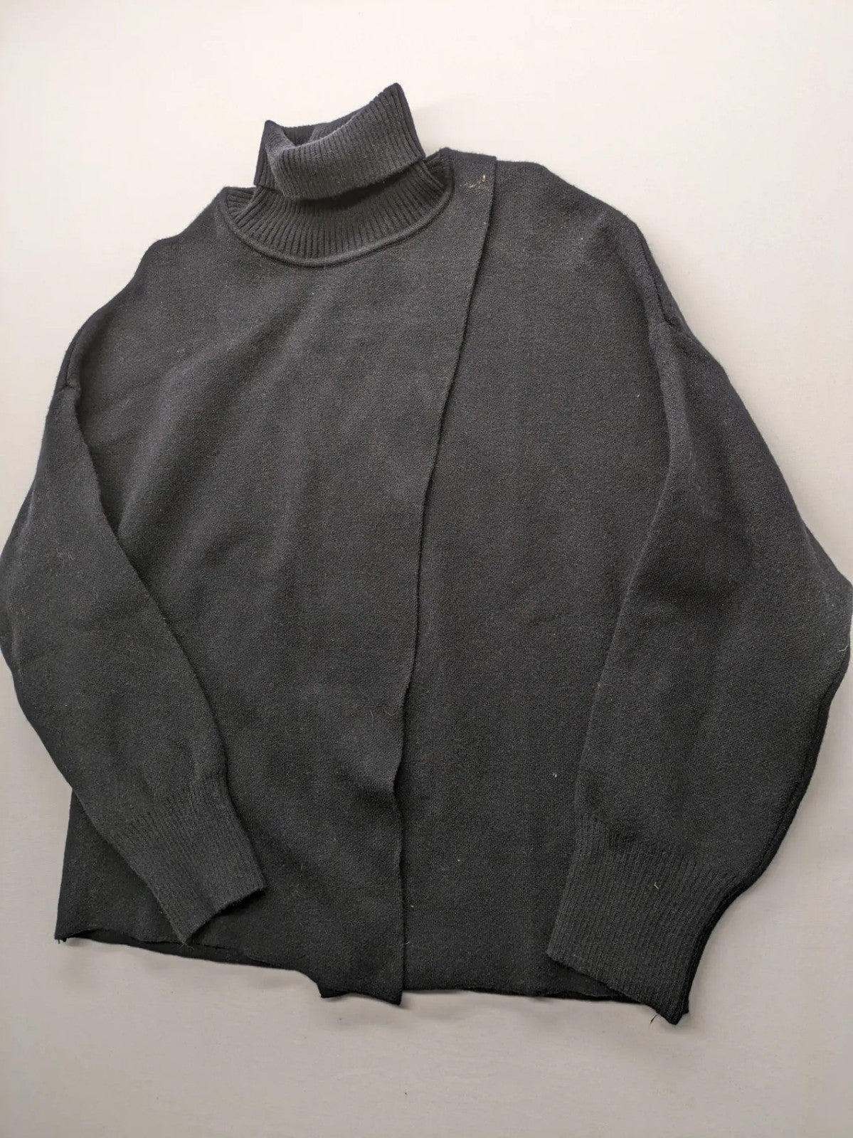 In Shape grey turtle neck jumper asymmetrical design, soft viscose blend material.
