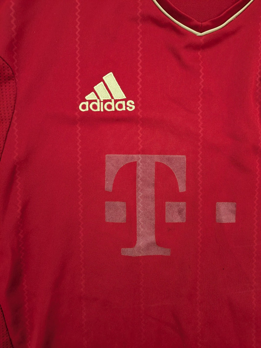 Adidas red soccer uniform with embroidered FC Bayern München crest and T-Mobile logo.