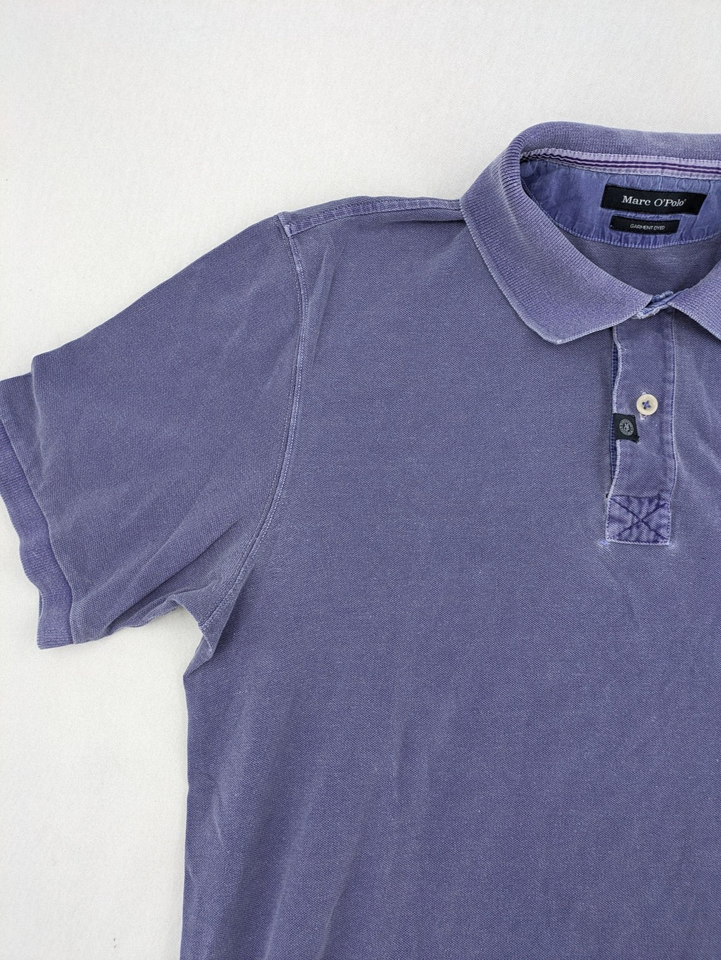 Marc O'Polo purple polo shirt garment dyed cotton with embroidered logo and intricate details.