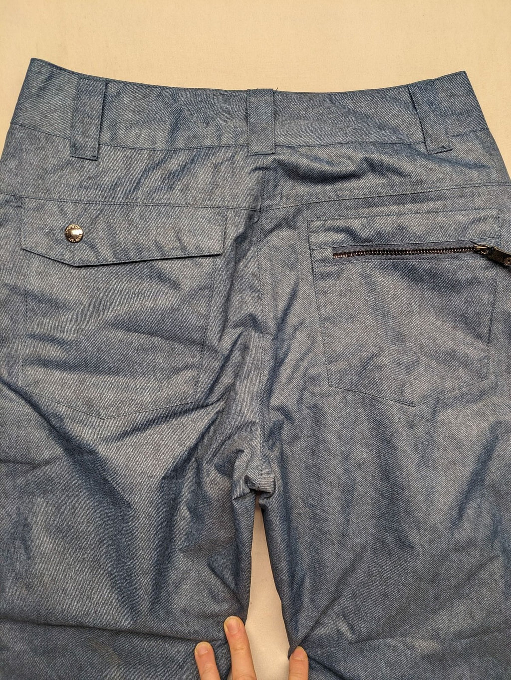 Snow Tech blue ski pants with modern denim look and durable polyester material.