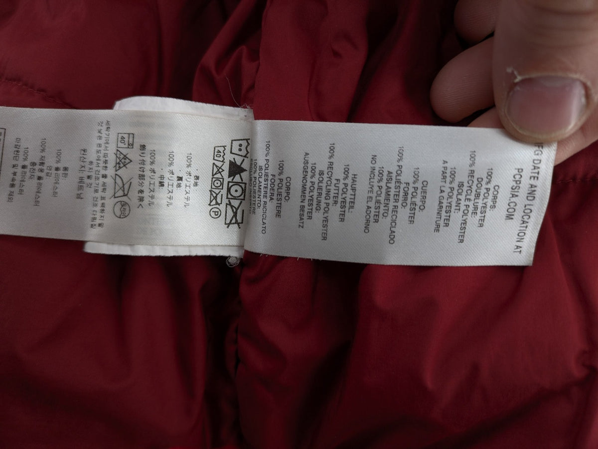 Patagonia red winter coat with hood, zip closure, snow skirt, and ski pass pocket.