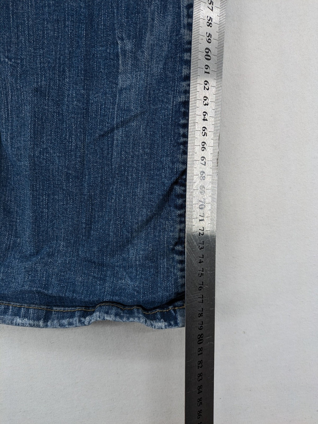 C&A blue bootcut jeans with faded denim and low rise fit, made from cotton blend.