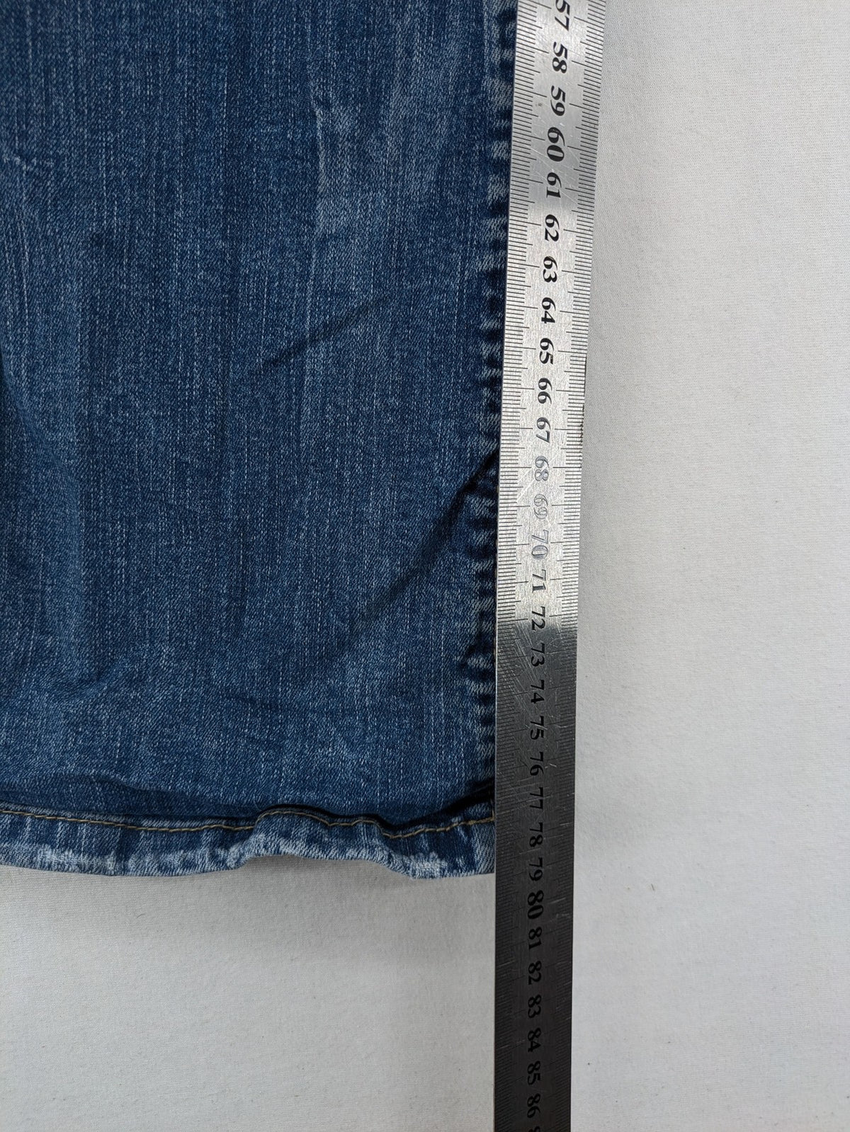 C&A blue bootcut jeans with faded denim and low rise fit, made from cotton blend.