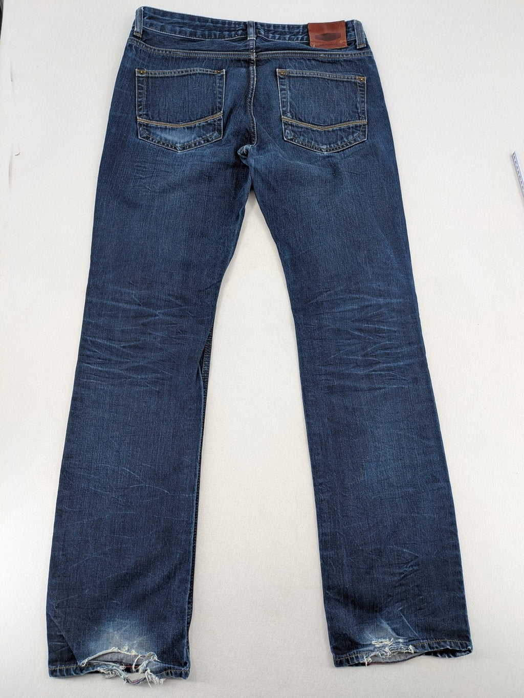 W32 blue straight jeans with classic 5-pocket design and dark wash denim.