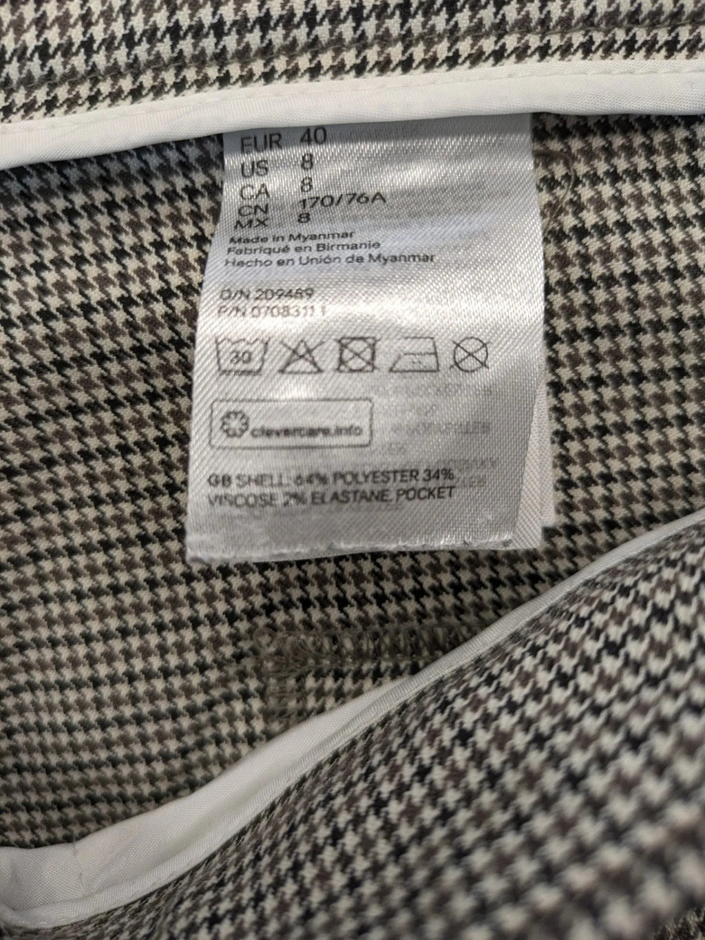 H&M beige pants houndstooth pattern with black and brown tones, stretchy material.