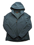 Kirkland Signature blue softshell jacket with hood, fleece lining, and zippered pockets.
