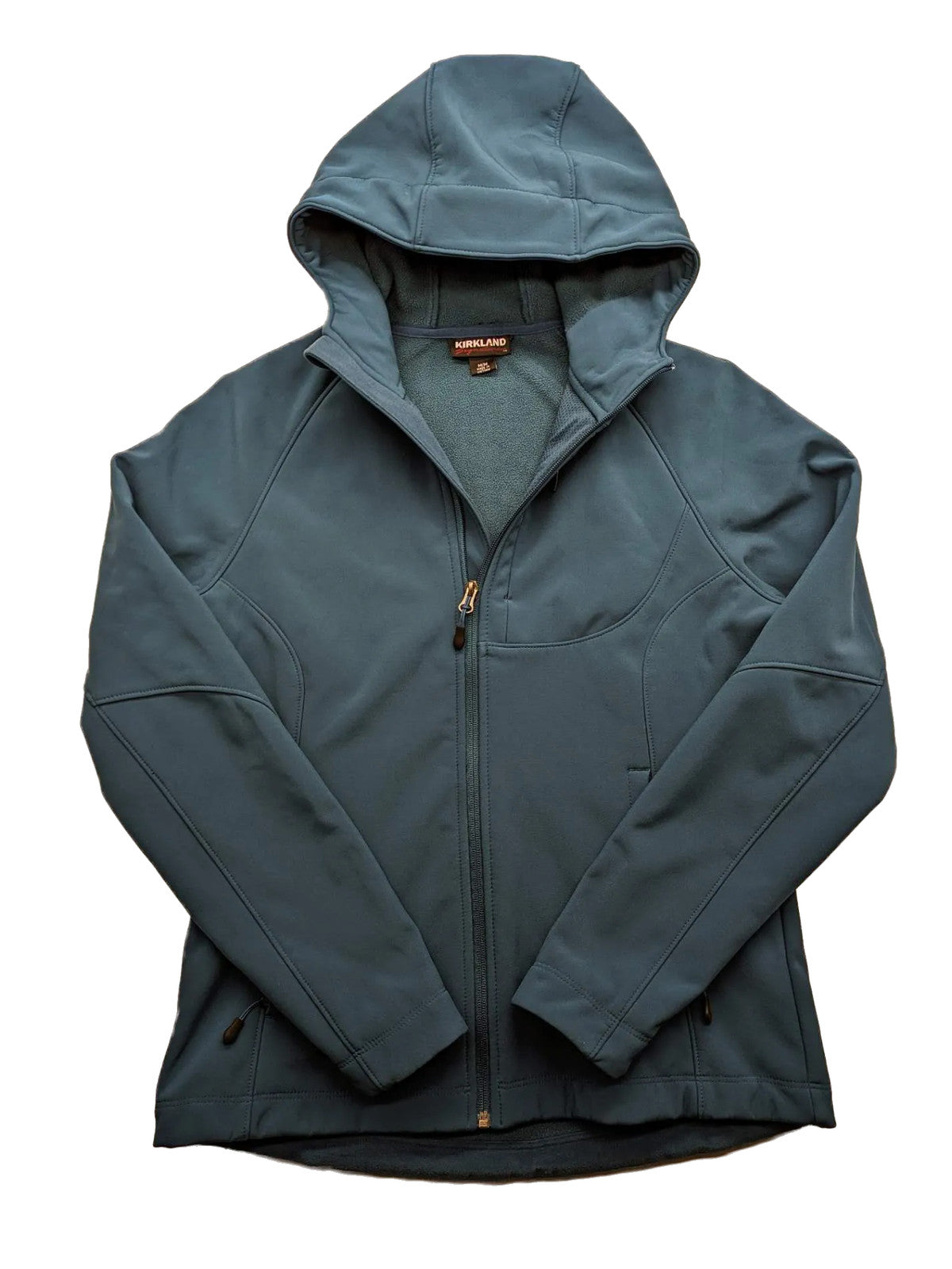 Kirkland Signature blue softshell jacket with hood, fleece lining, and zippered pockets.