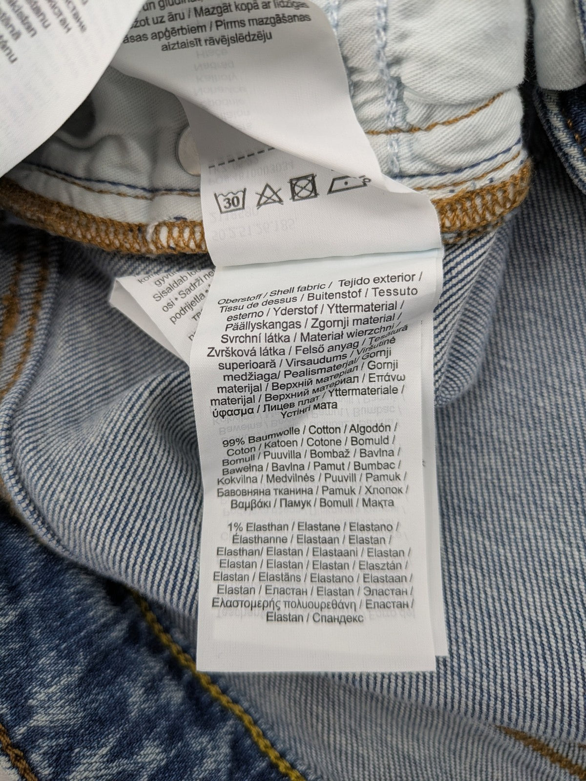 QS by s.Oliver green bootcut jeans with ankle zippers and classic denim wash.