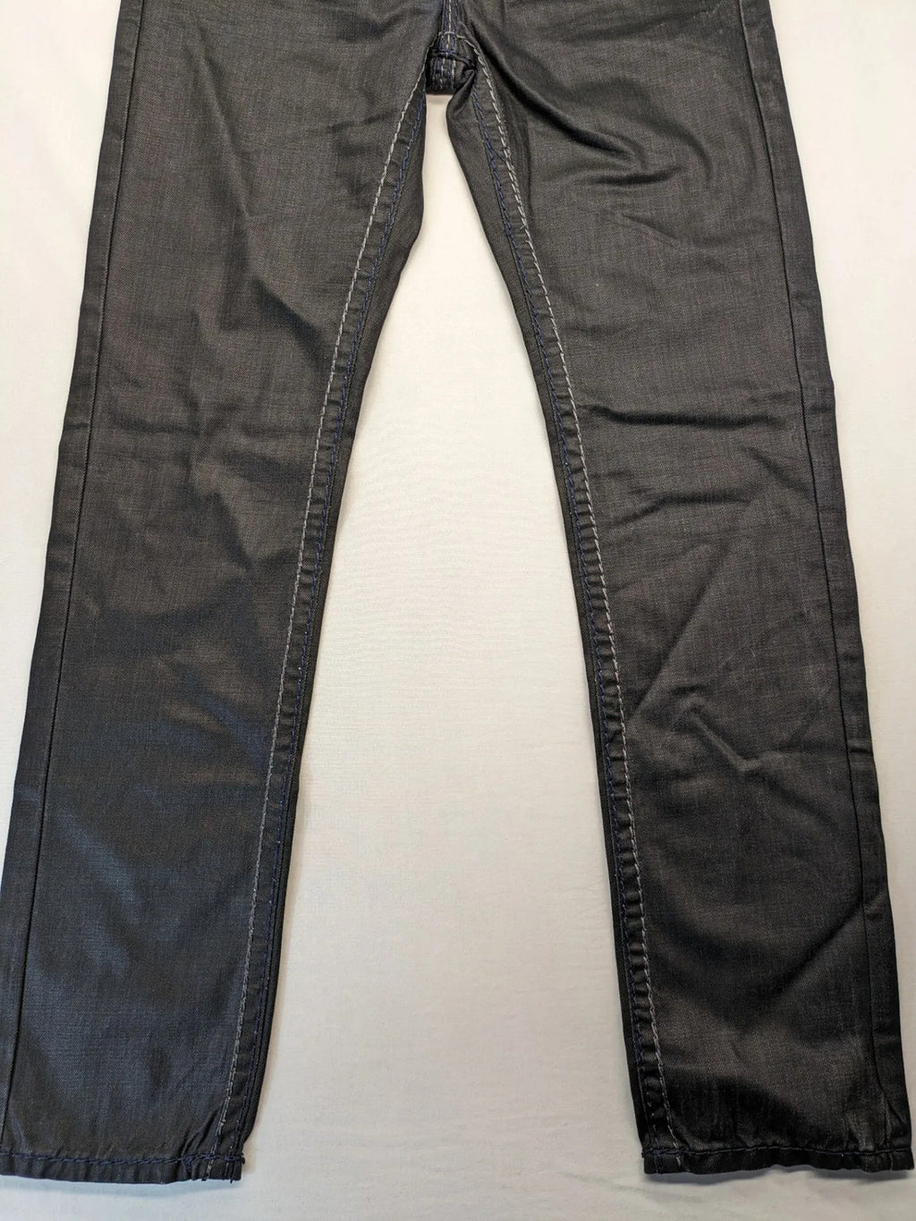 Fadnoble grey straight jeans with button fly and contrasting stitching details.