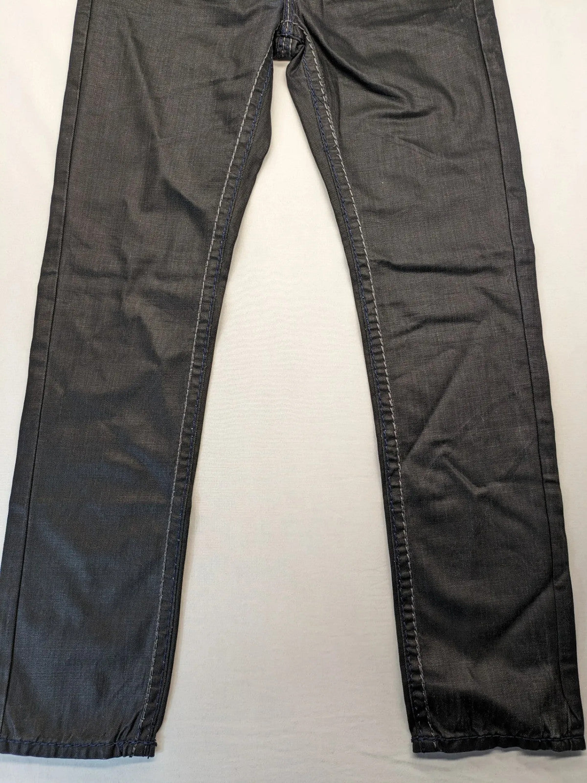 Fadnoble grey straight jeans with button fly and contrasting stitching details.