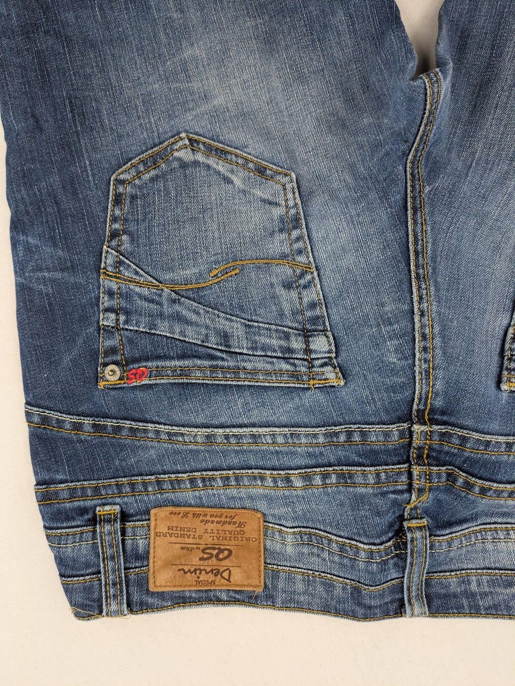 QS by s.Oliver green straight jeans five-pocket design with unique double button closure