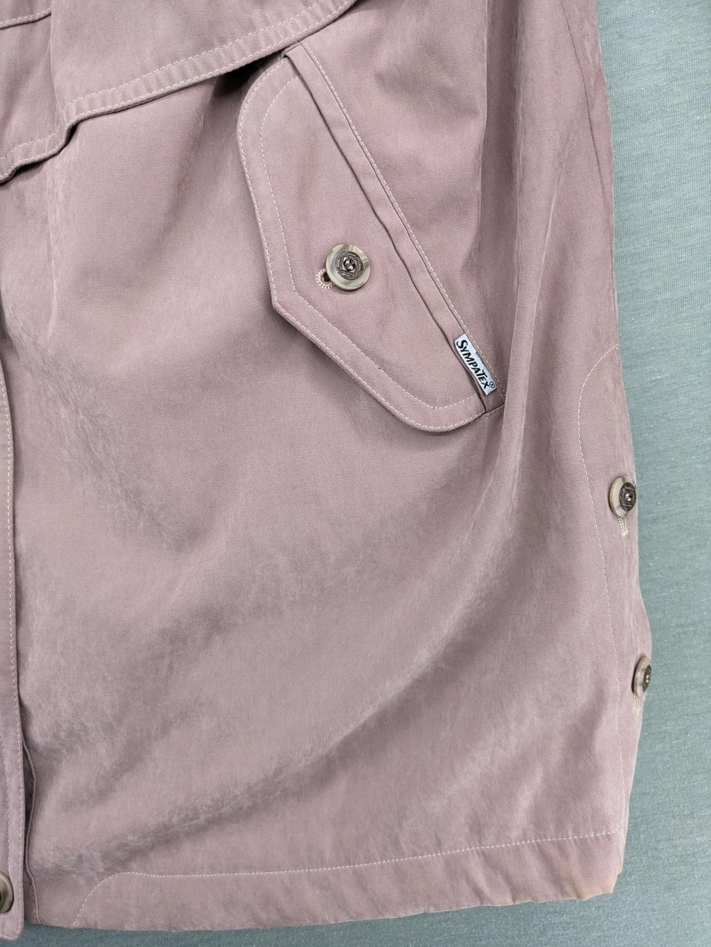 Goldix beige coat with checkered lining and Sympatex waterproof technology.