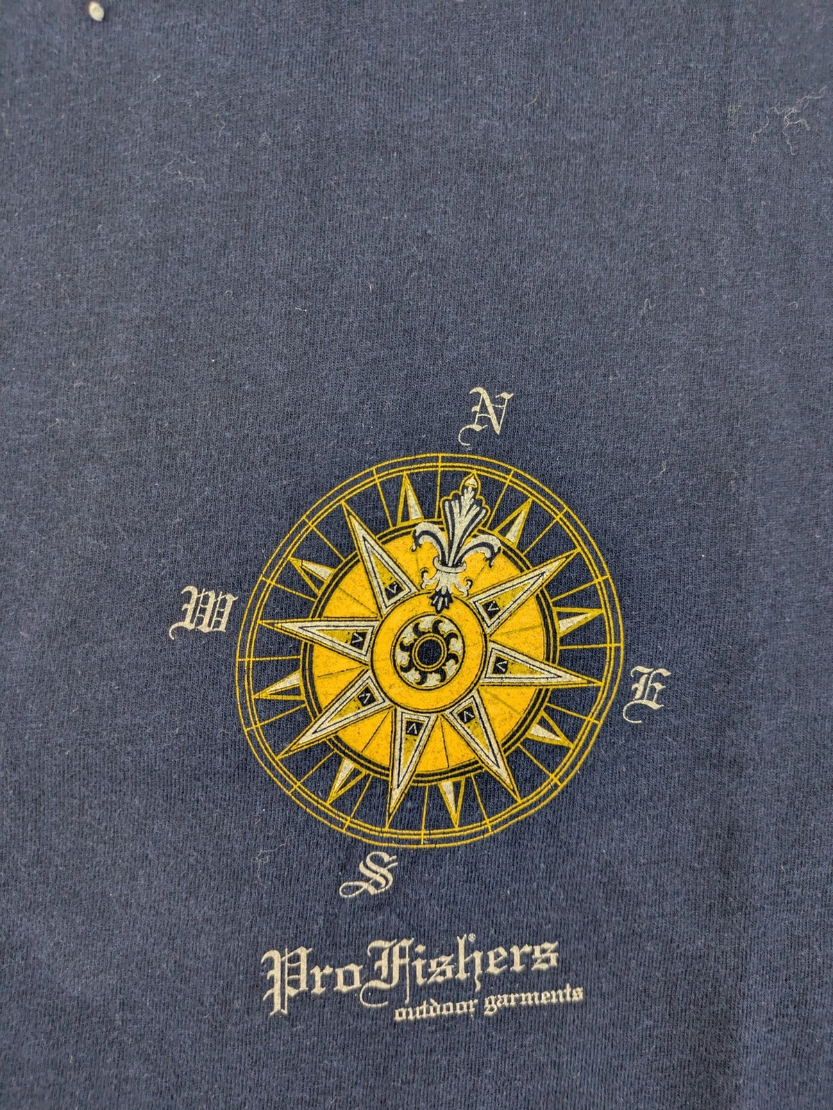 ProFishers navy t-shirt with compass print and large fish graphic on back.