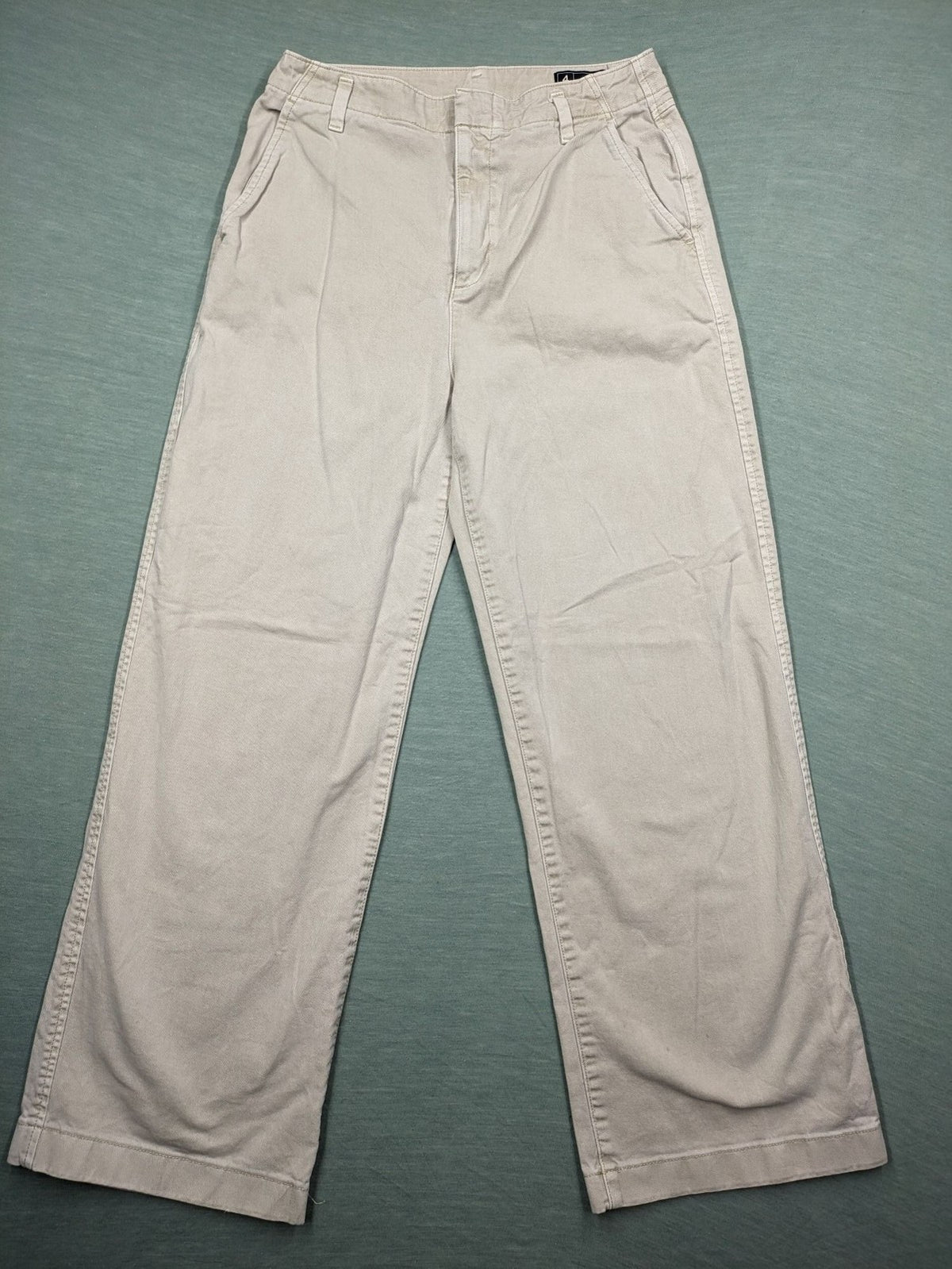 Gap beige loose-fit chino pants made from 100% cotton with relaxed wide-leg design.