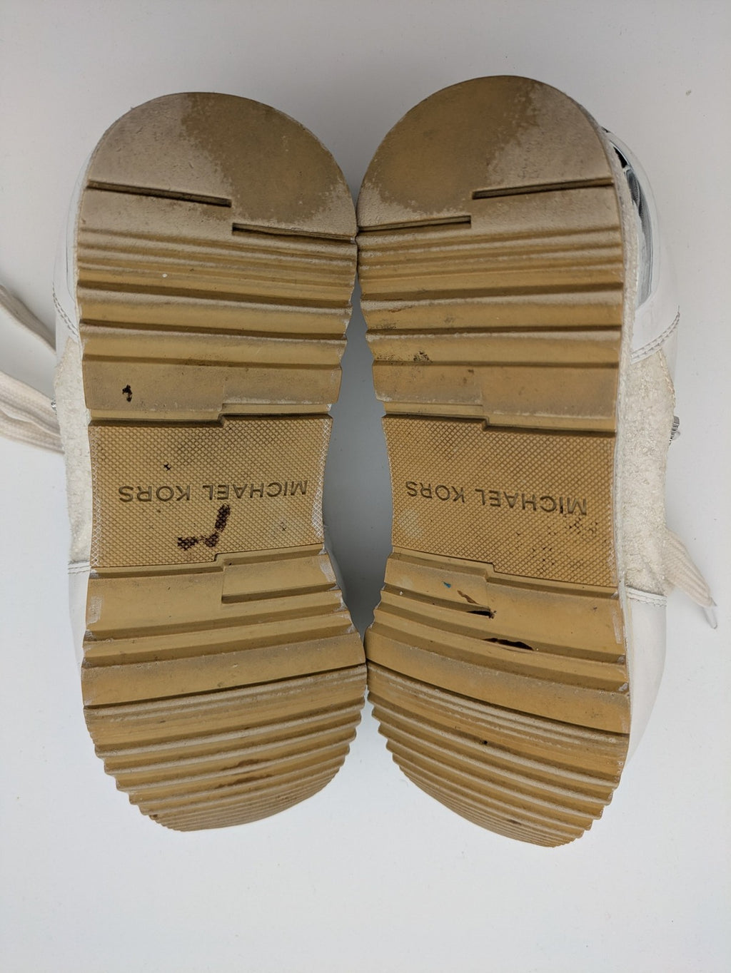 Michael Kors multi sneaker white leather and cream textile with silver logo details.