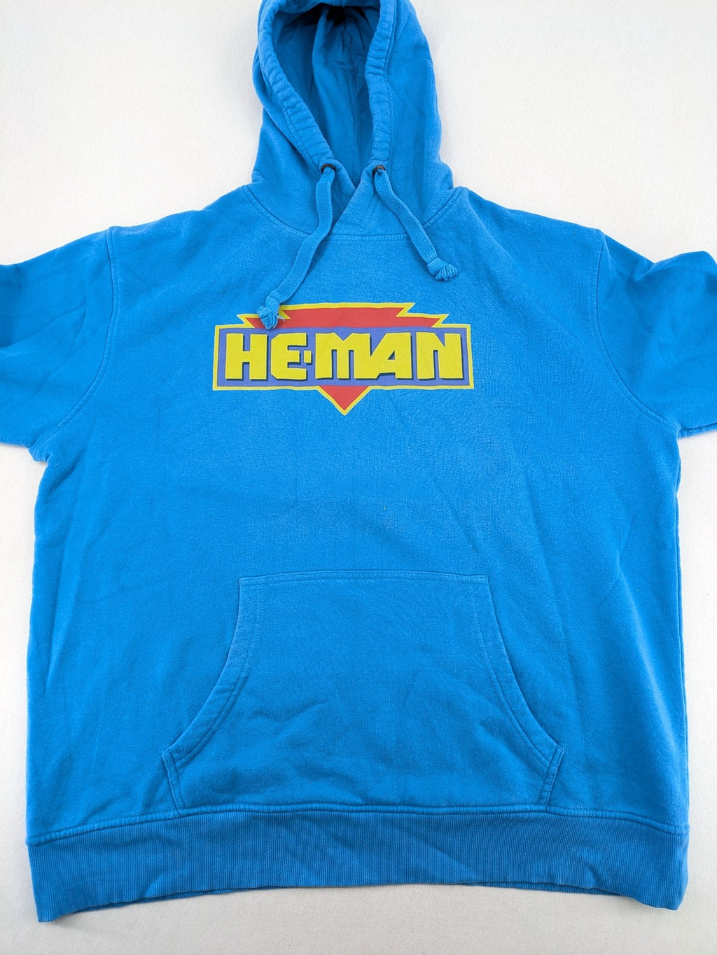 Masters of the Universe blue zip-through hoodie featuring large He-Man logo and drawstring hood.