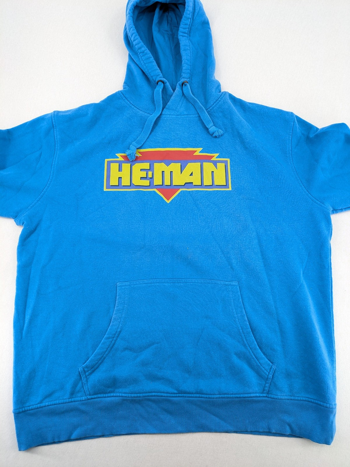 Masters of the Universe blue zip-through hoodie featuring large He-Man logo and drawstring hood.