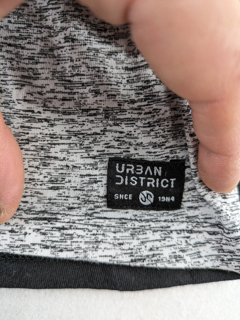 Angelo Litrico black and grey colorblock t-shirt with logo accents and soft cotton blend.