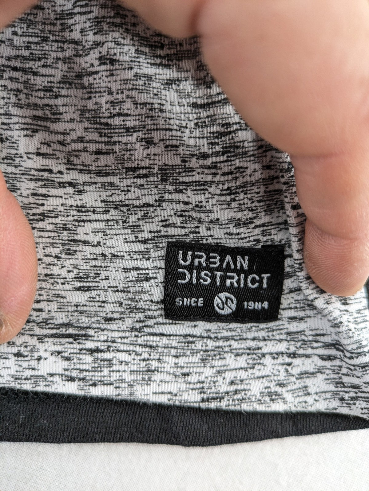 Angelo Litrico black and grey colorblock t-shirt with logo accents and soft cotton blend.