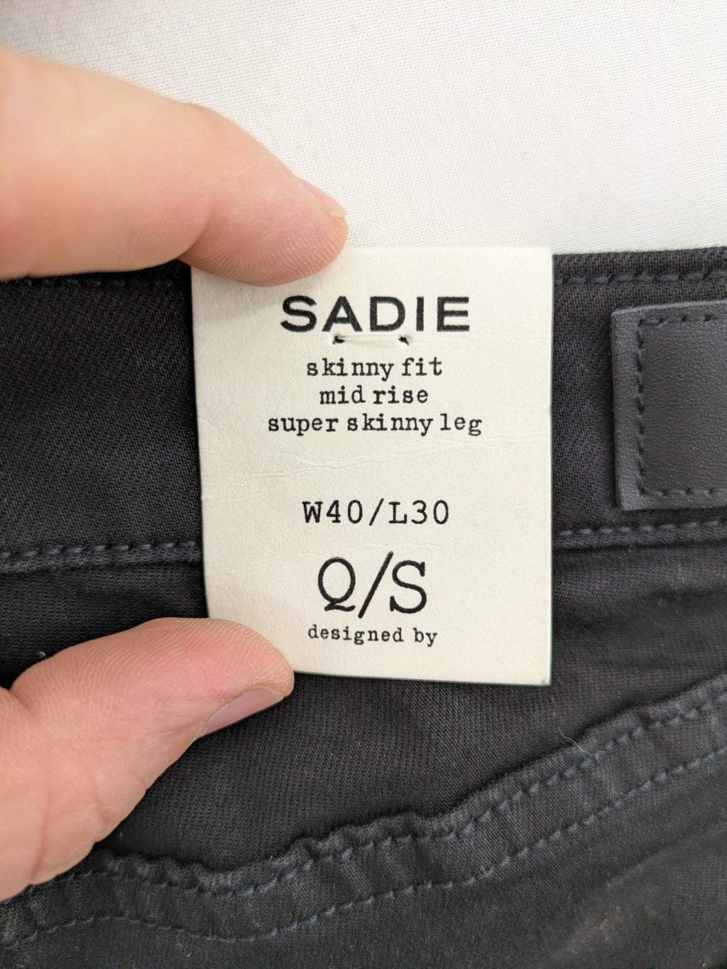Q/S skinny fit jeans black mid-rise with stretch fabric and sleek silhouette.