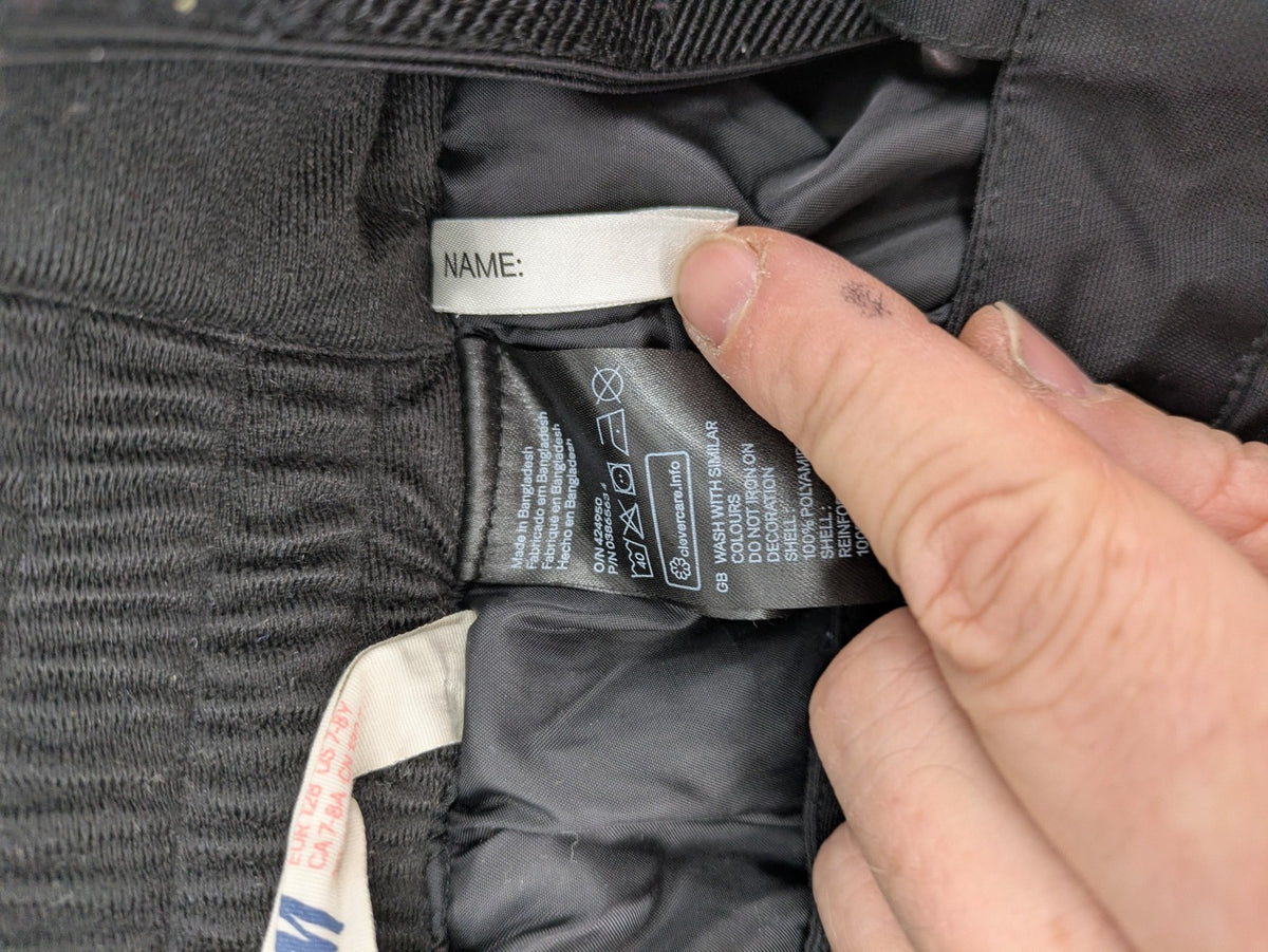 H&M grey snow overalls with adjustable straps and front zipper, durable winter wear.