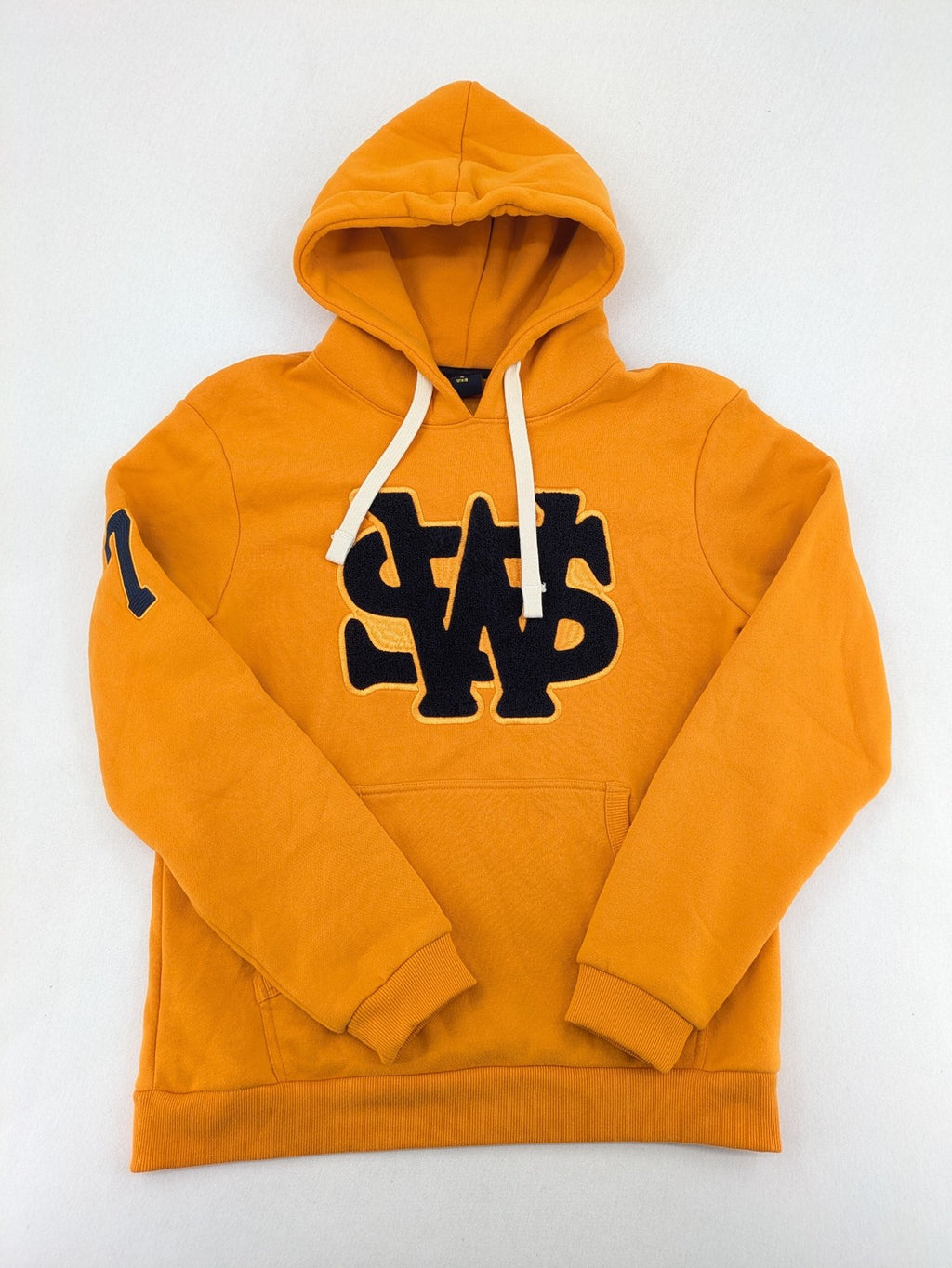 Superdry orange turtle neck jumper with textured logo patch and number 7 detail.