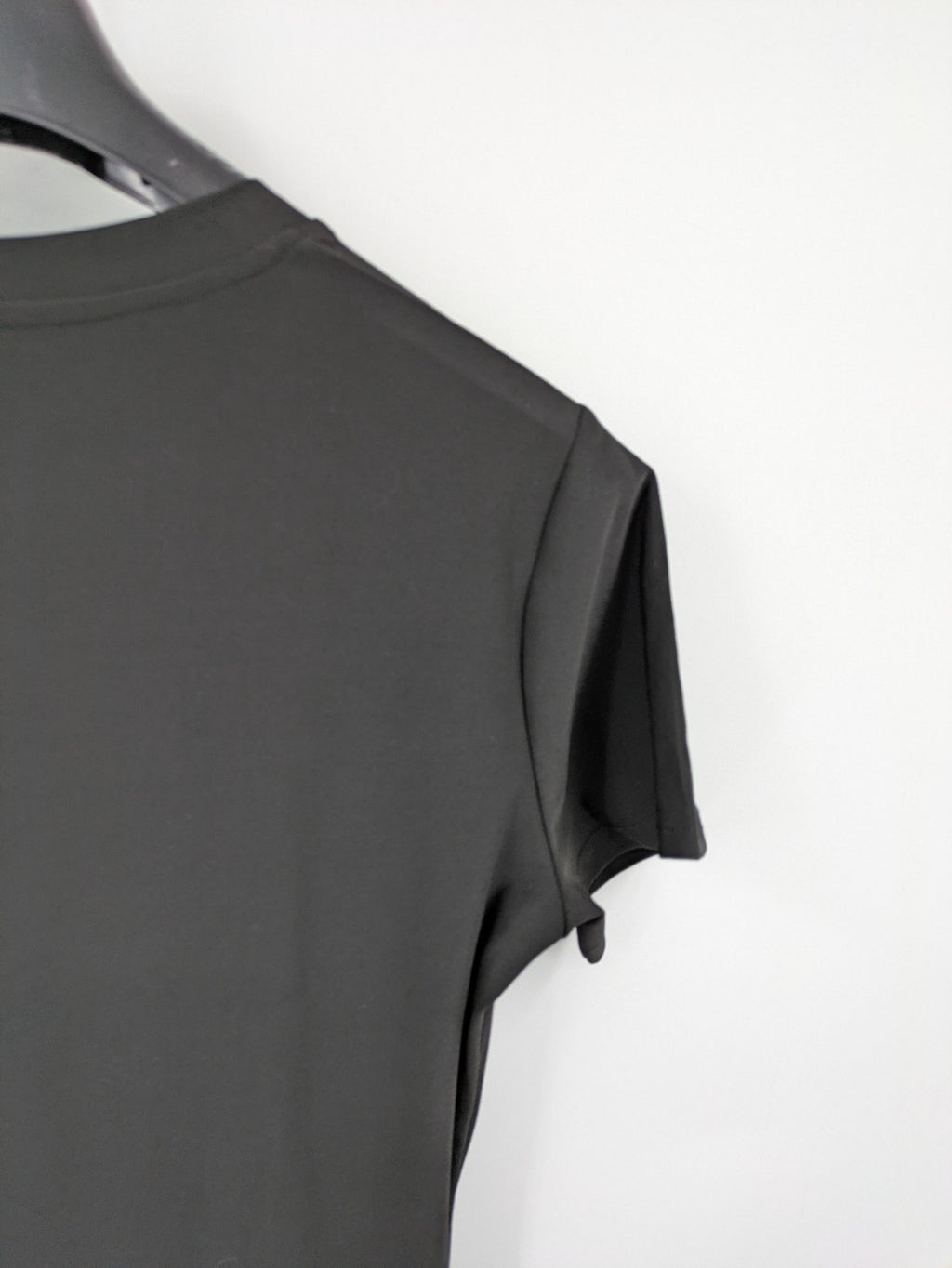 Milano black bodycon T-shirt dress with stylish print and side slit detail.