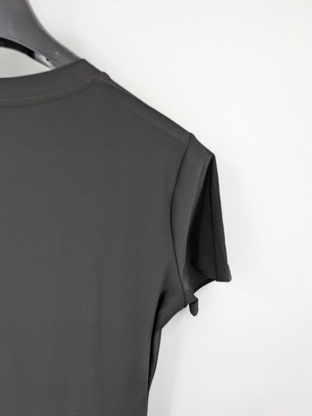 Milano black bodycon T-shirt dress with stylish print and side slit detail.