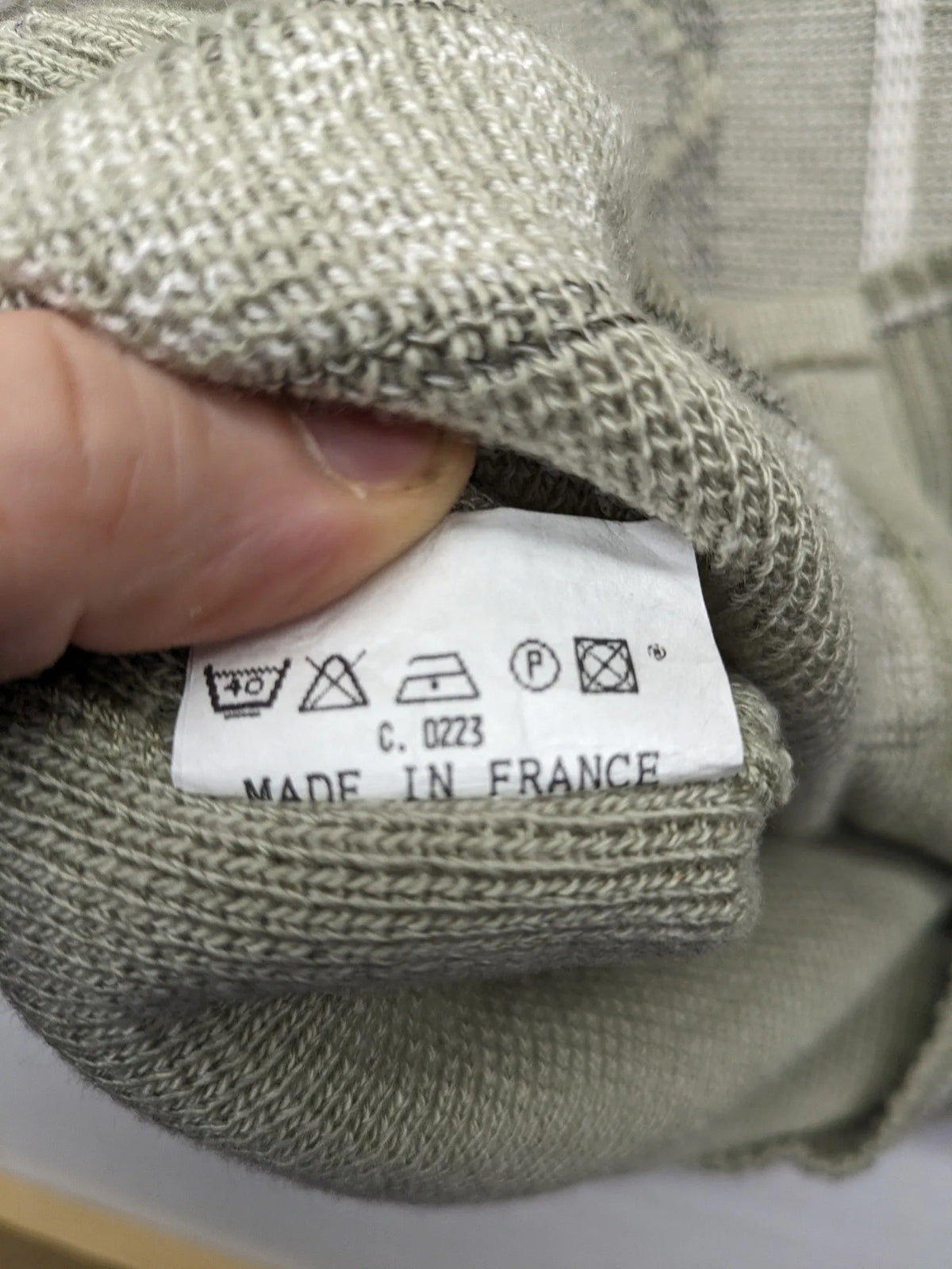 Lewträger cream and grey turtle neck jumper with geometric pattern and button placket.