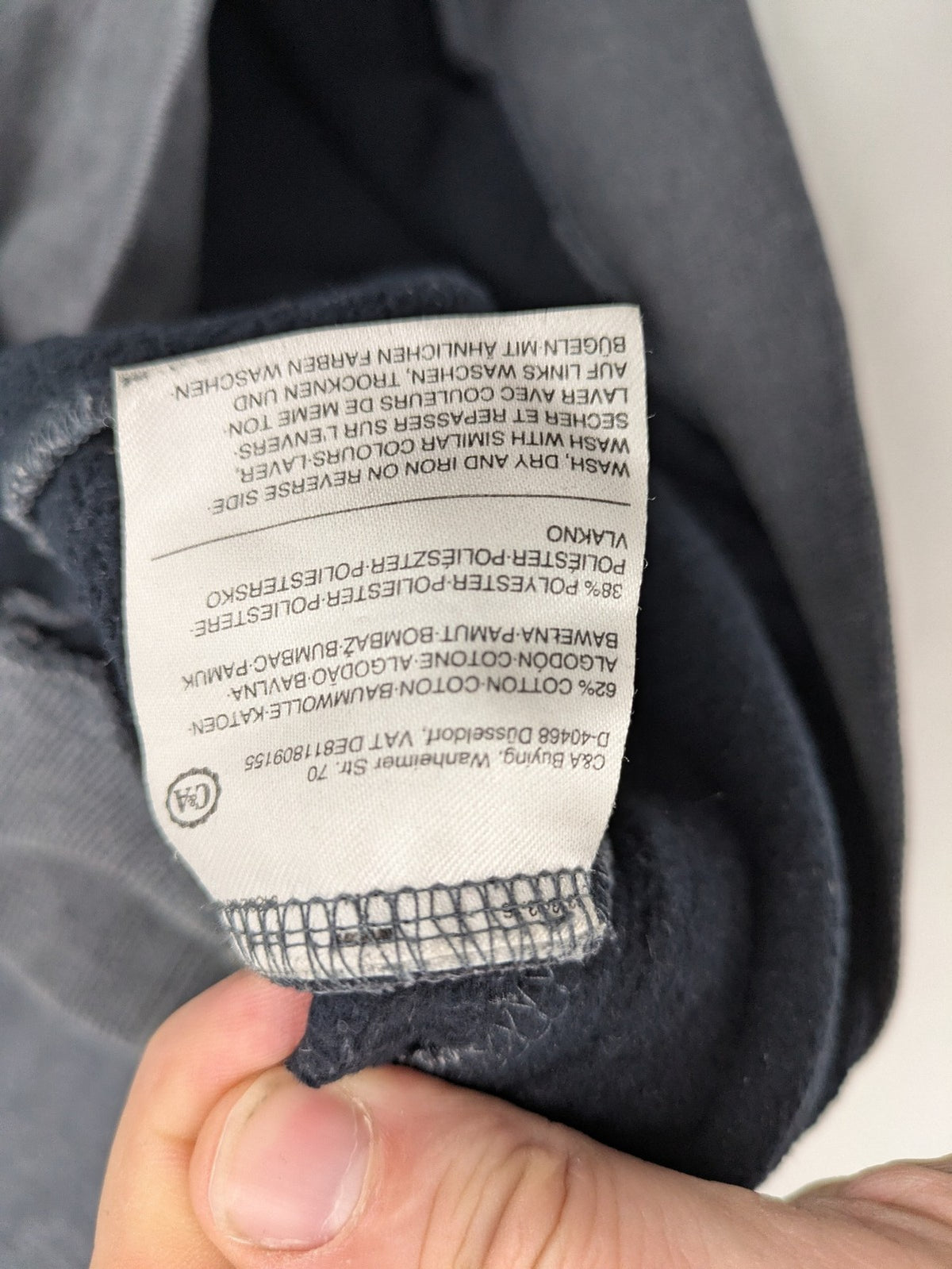 C&A grey hoodie with embossed chest logo, teddy-lined hood, and side zip pockets.