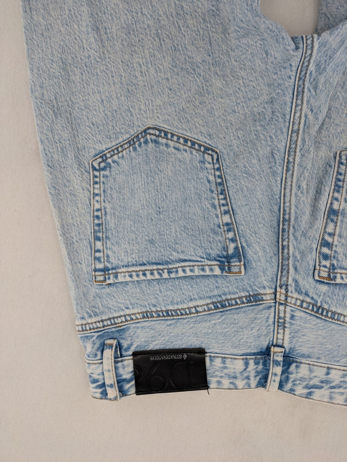Stradivarius blue high waist flare jeans with acid wash and classic five-pocket design.