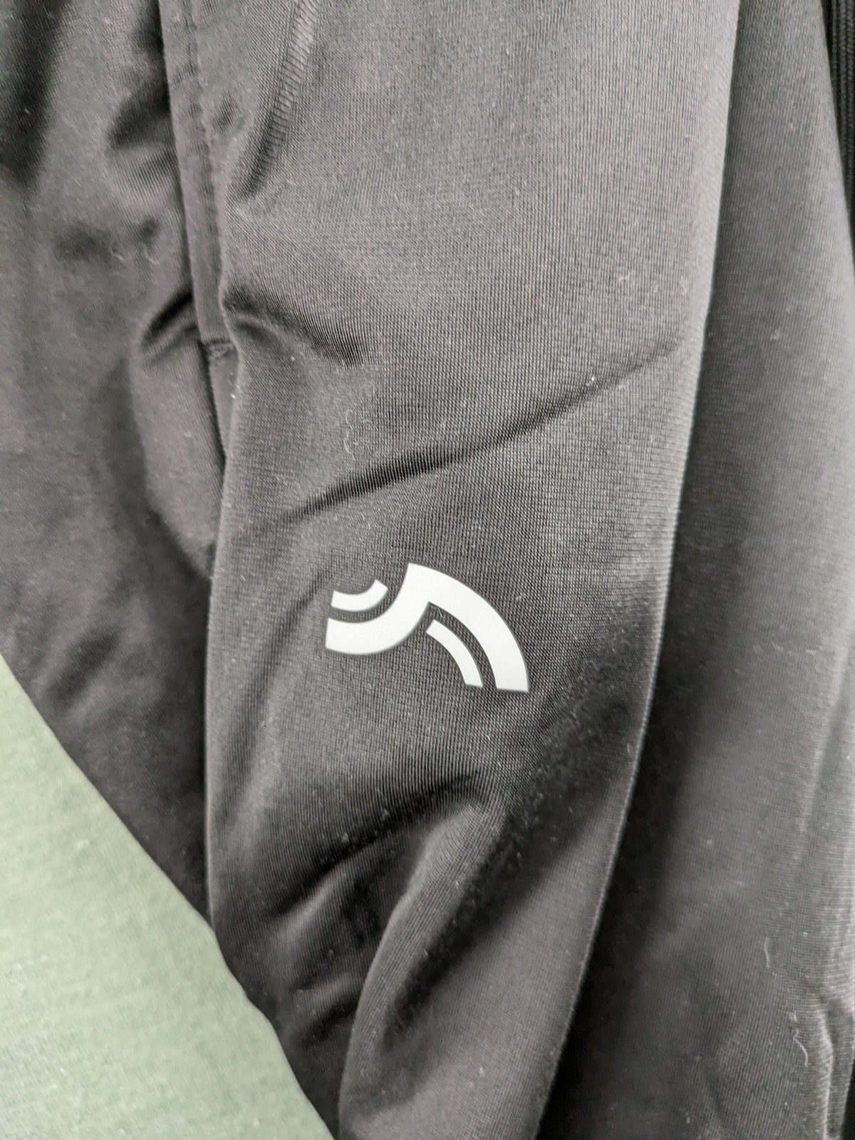 Crivit black weighted training pants with elastic waistband, side pockets, and zippered cuffs.