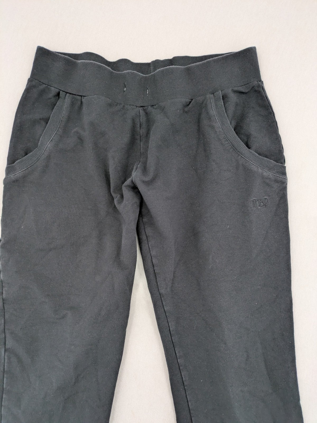 Manguun Sports grey jogger pants soft cotton blend with subtle logo embroidery and elastic waistband.