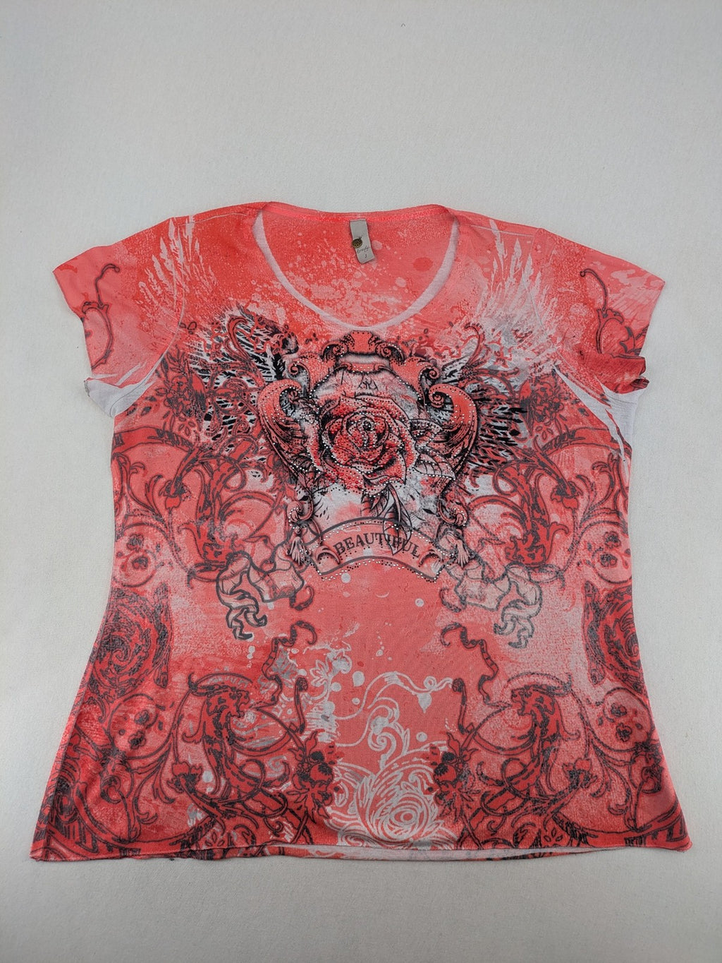 TREDY pink graphic top with rose and wings design, embellished with rhinestones.