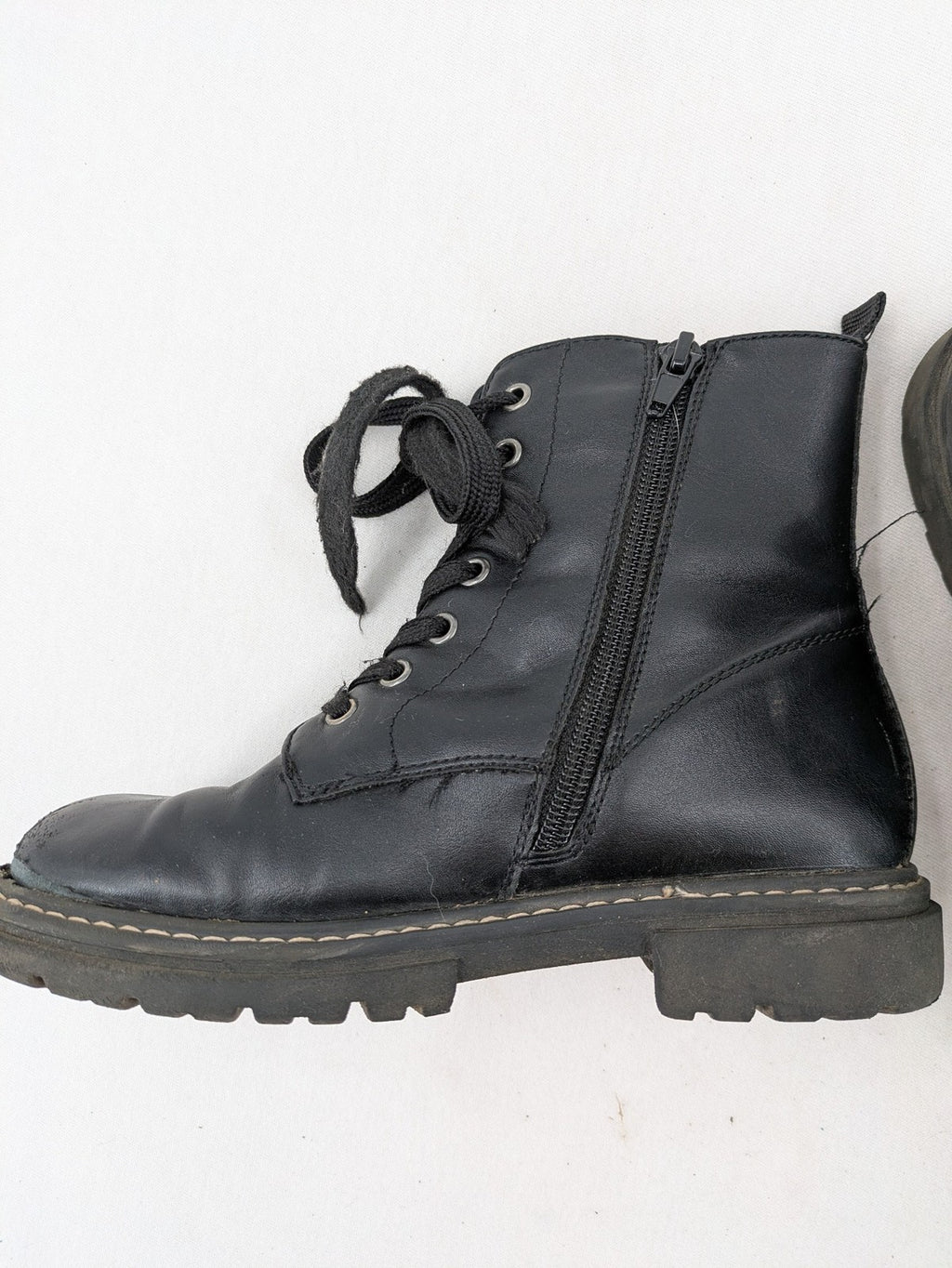Esprit black combat boots for girls with lace-up front and side zipper detail.