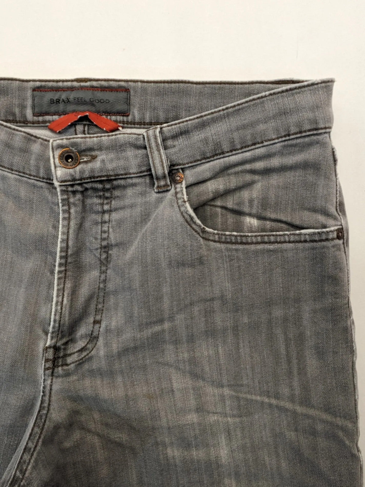 BRAX grey straight jeans with classic 5-pocket style and washed denim finish.