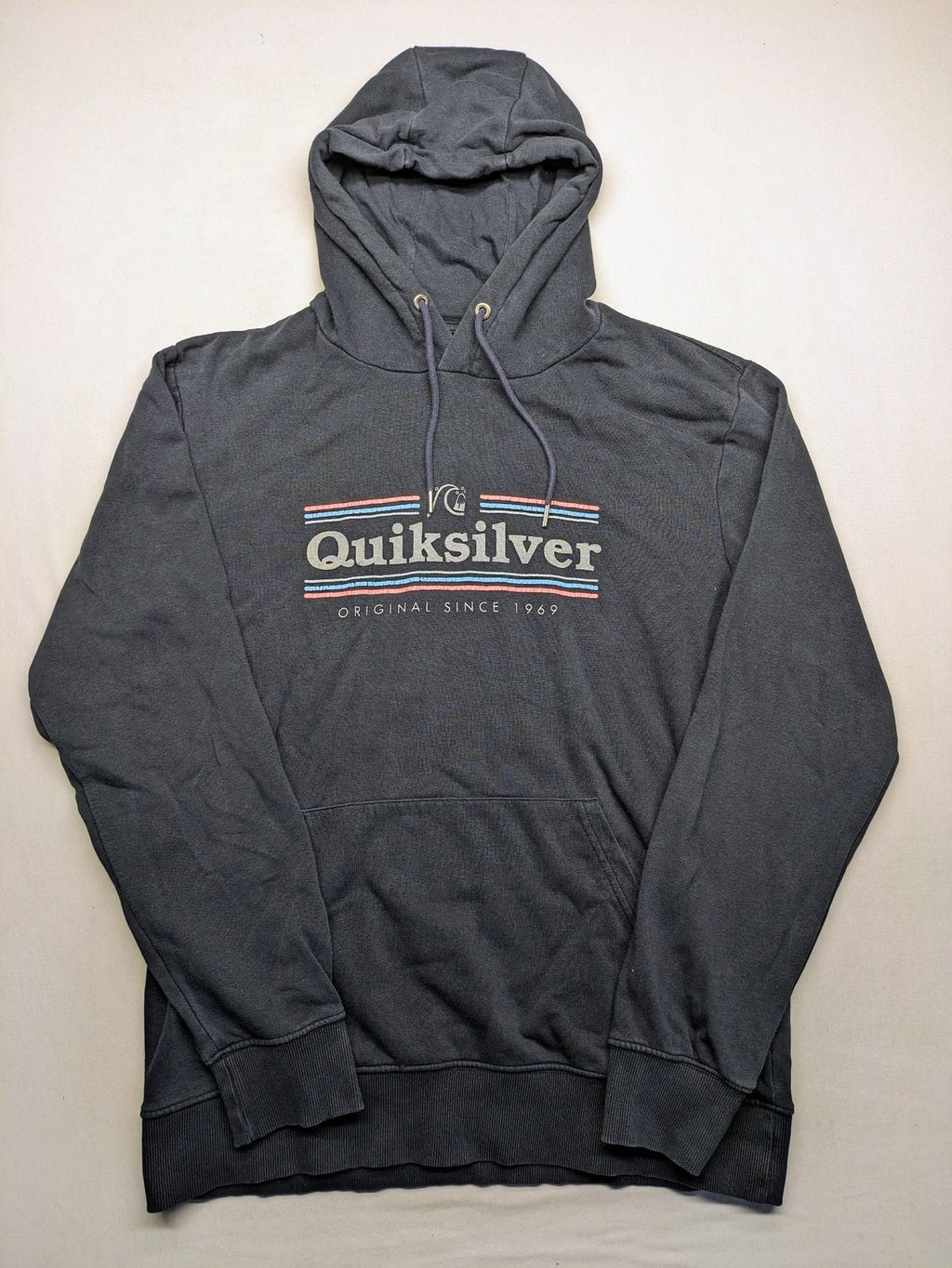 Quiksilver grey hoodie with logo graphic, kangaroo pocket, and adjustable hood.