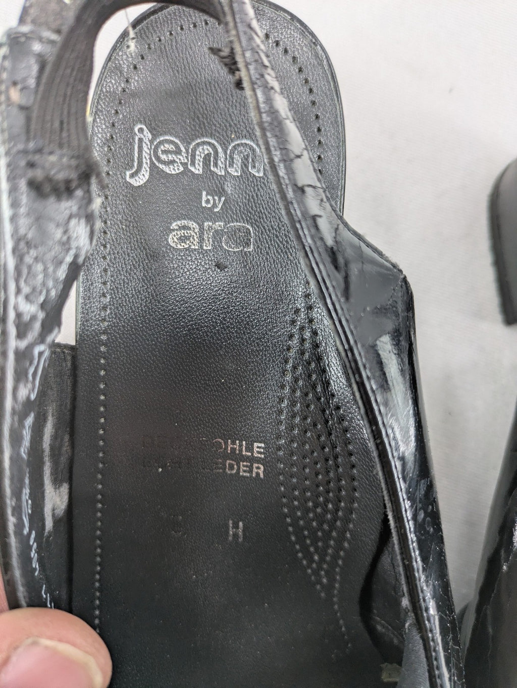 Jenny by Ara black slingback pumps with peep-toe front and glossy finish.