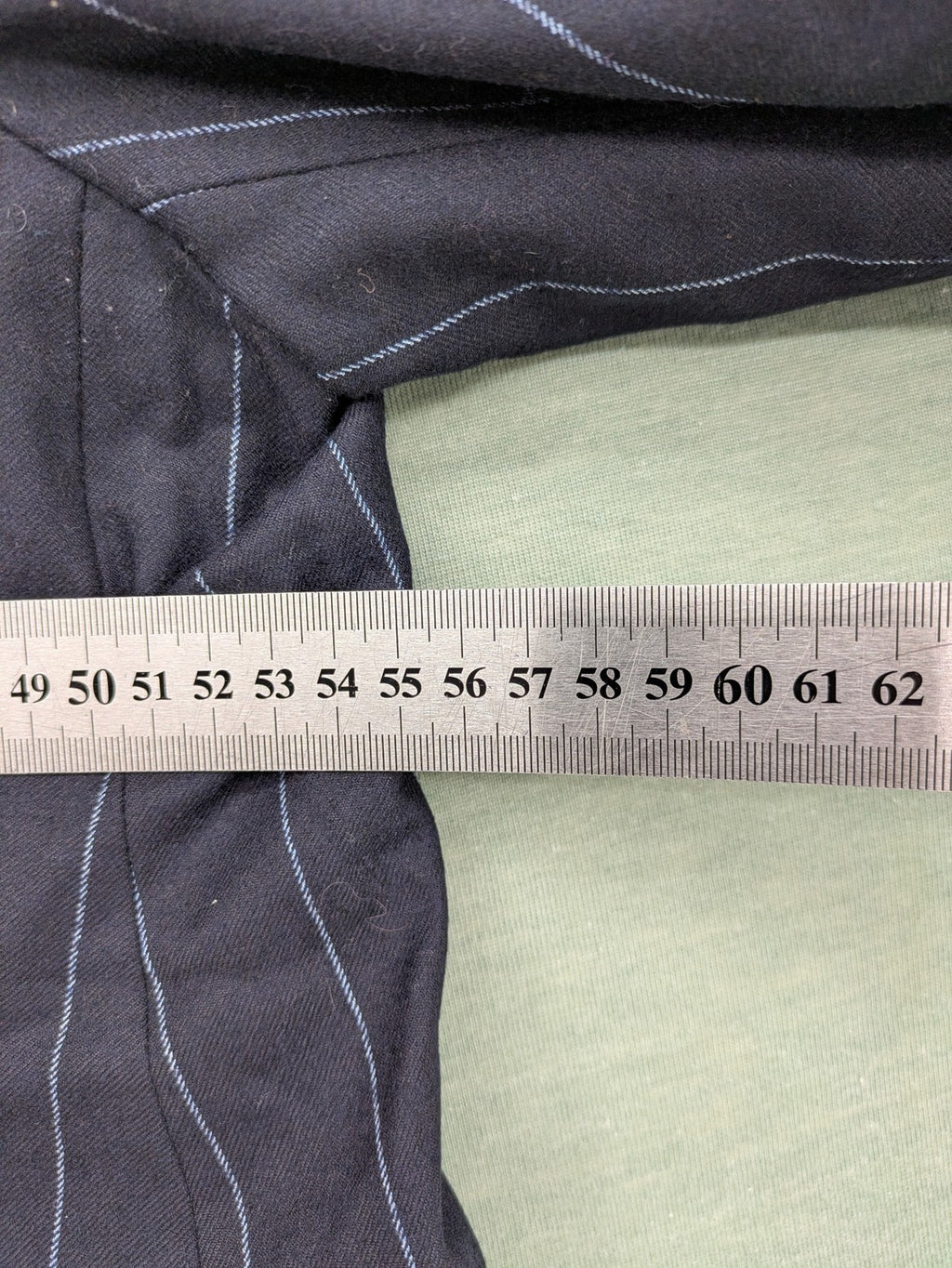 Bogner grey blazer with black pinstripes and contrast stitching, made of 100% virgin wool.