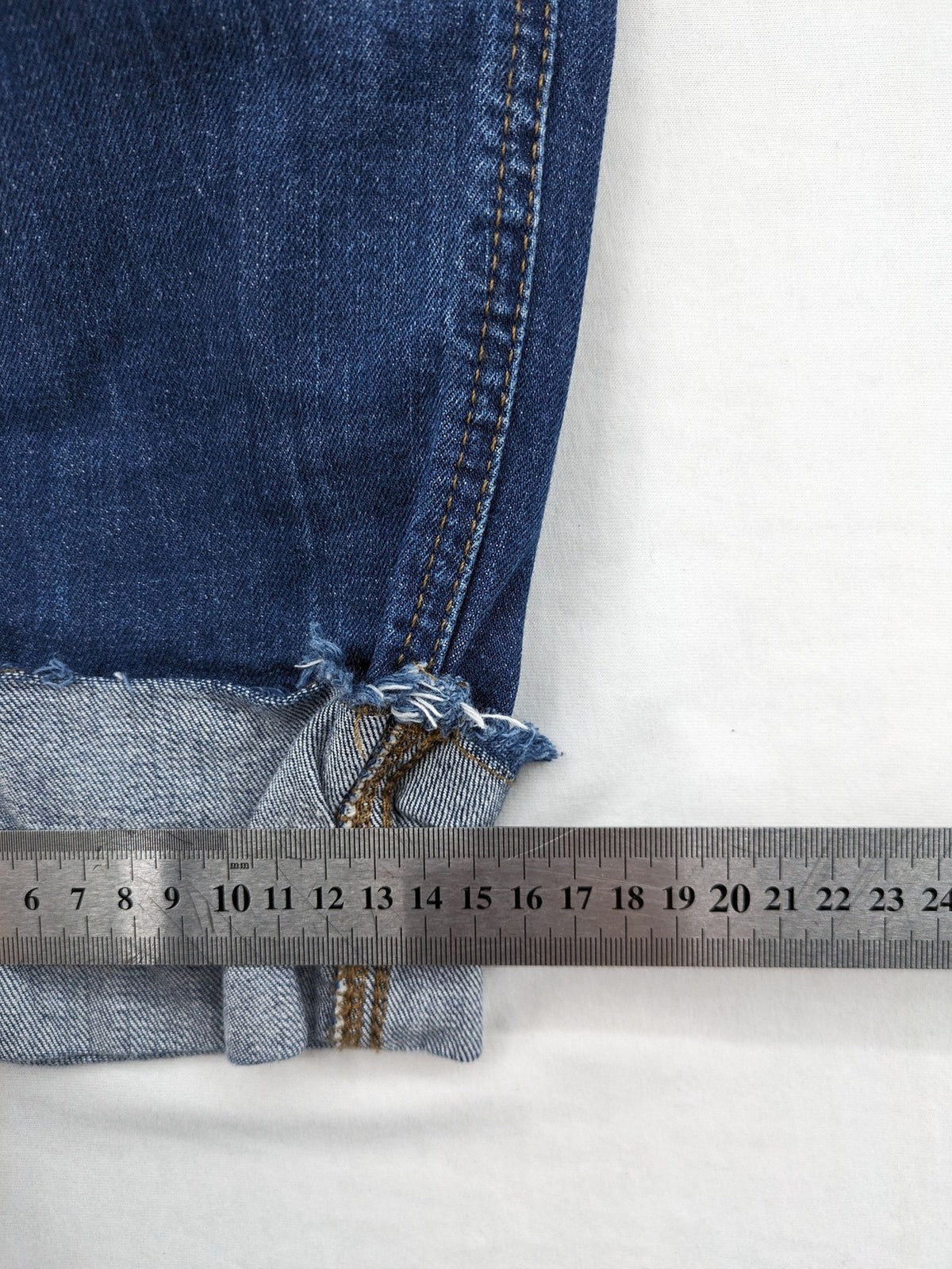 Esprit blue straight leg jeans with ripped knee details and rolled hem.