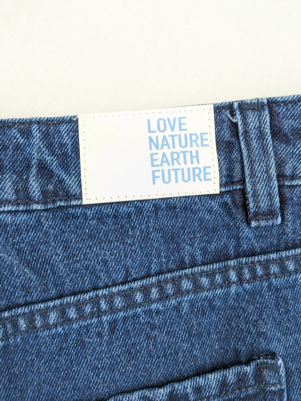Tchibo blue straight jeans with five-pocket design and wide leg cut in durable cotton.