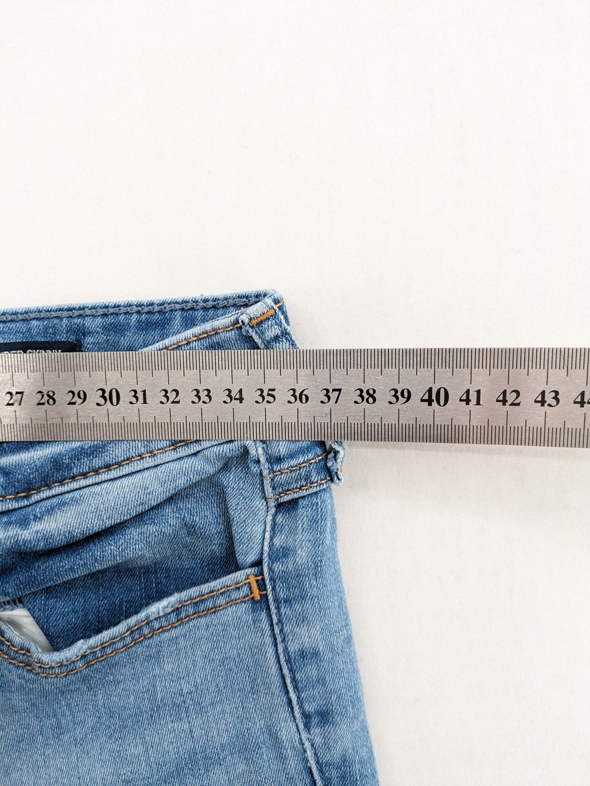 Hollister blue high rise super skinny jeans with frayed hem and classic stretch denim.