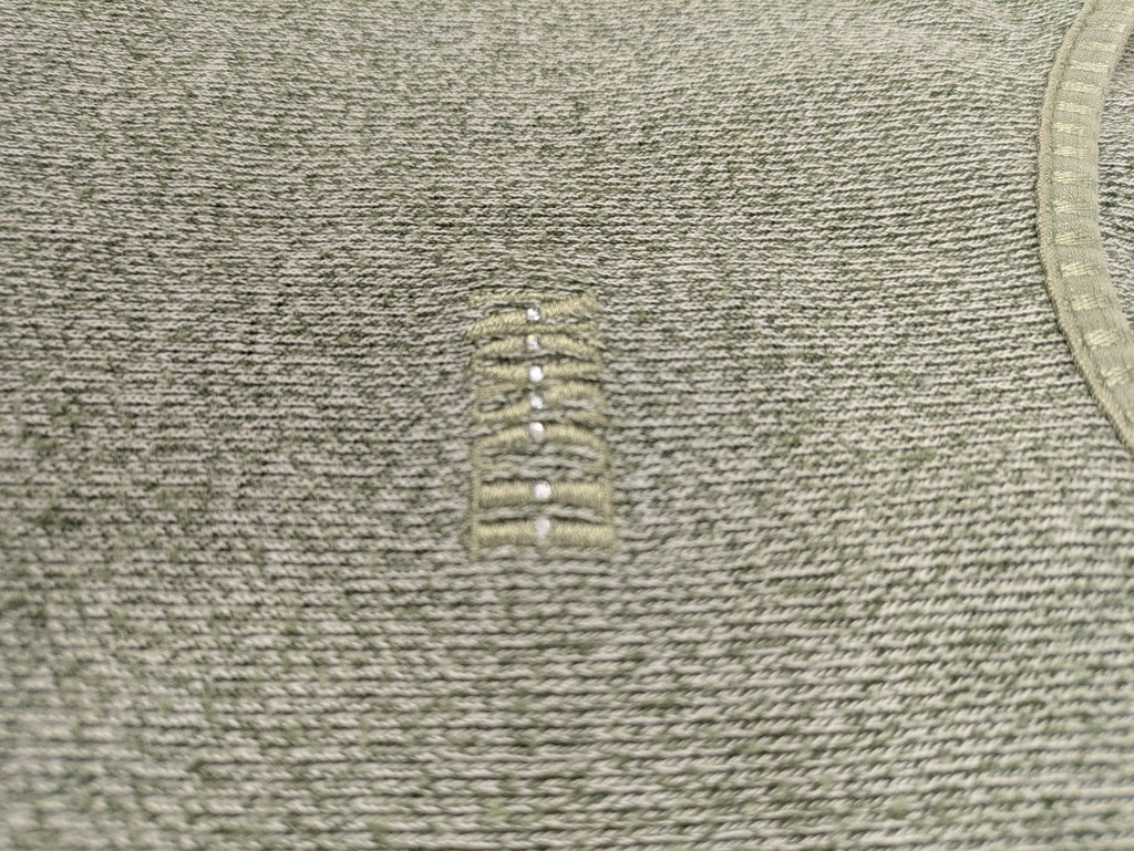 NOSCH knit jumper grey textured fabric with embroidered logo and subtle rhinestone accents.