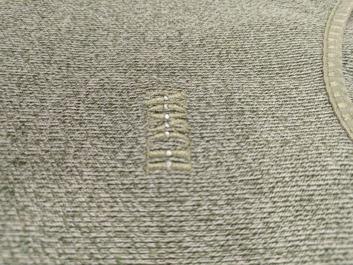 NOSCH knit jumper grey textured fabric with embroidered logo and subtle rhinestone accents.